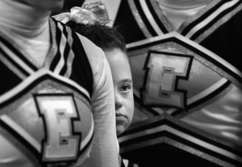 With butterflies in her stomach, Megan Bomgaars, 14, waits to compete with her fellow cheerleaders at the State Cheerleading finals at the Coliseum in Denver, Colorado. 