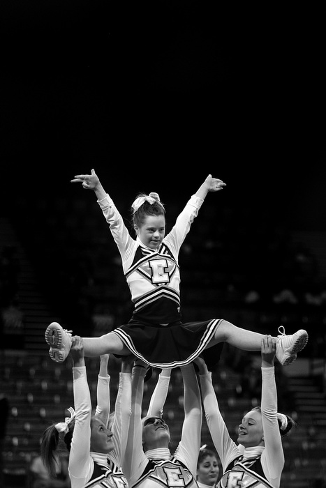 Megan Bomgaars, 14, does her routine with her fellow cheerleaders at the State Cheerleading Championships at the Denver Coliseum in Denver, Colorado.