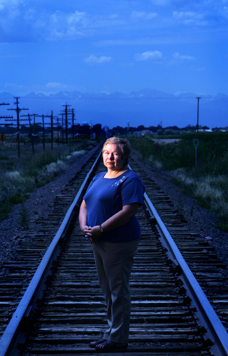 Nancy Alles Stroh stands on the tracks at the place where the school bus she was riding was hit by a passenger train on Dec. 14, 1961. Nancy suffered broken vertebrae and ribs. Several of her relatives were killed in the accident. 