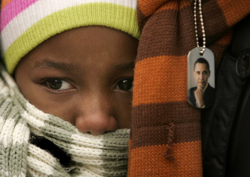 Ranoah Johnson, 8, waits for President-Elect Barack Obama to speak to a crowd estimated at 30,000 at the War Memorial Plaza during a Whistle Stop Tour in Baltimore, MD, on Saturday, Jan. 17, 2008, just days before the inauguration. 