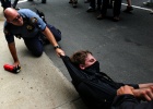 A police officer tries to arrest a protestor in downtown St. Paul before the start of the Republican National Convention in St. Paul, Minnesota on Monday, September 1, 2008. (Photo by Chris Schneider)