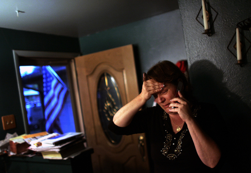 Michelle Benavidez cries as she speaks with her nephew Staff Sergeant William Owen at her home in Arvada, Colo., on Thursday, September 11, 2008. Her son Kennith Mayne, 29, was killed in Iraq. {quote}He's the reason I'm in the infantry,{quote} said Owen. (Photo by Chris Schneider)