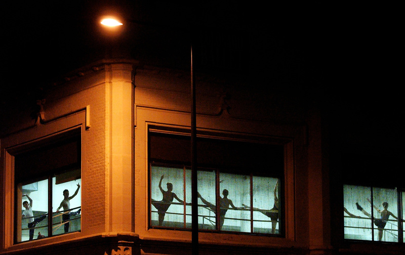 Members of a ballet class practice in front of the windows of the Colorado Ballet in Denver, Colorado. The students are learning ballet technique and some are selected from the classes to be part of the performances with the Colorado Ballet as needed. (Photo by Chris Schneider)