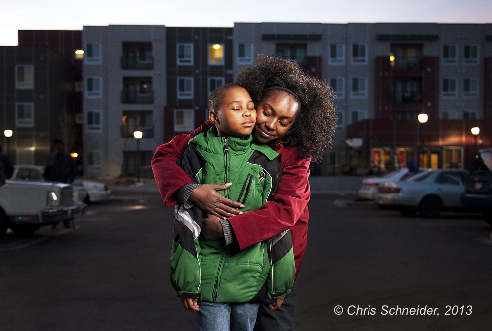 A portrait of a Mercy Housing resident with her son at her home in Denver for the Mercy Housing annual report.