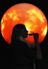A woman drinks a glass of wine during Science Lounge at the Denver Museum of Nature & Science in Denver, Colorado.