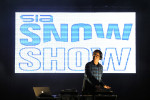 A DJ performs during the fashion show during the SIA Snow Show at the Colorado Convention Center in Denver, Colorado.